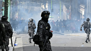 Police, protesters clash in new marches against Bolivian leader