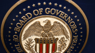 Gold hits record, stocks diverge as Trump fuels Fed fears