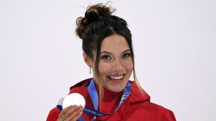 Gu forced to wait as heavy snow postpones Olympic halfpipe final