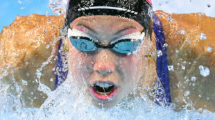 'Fragile' Walsh defies illness to win butterfly world gold