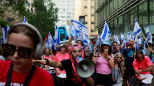 Israelis throng train stations, block roads to protest judicial reforms