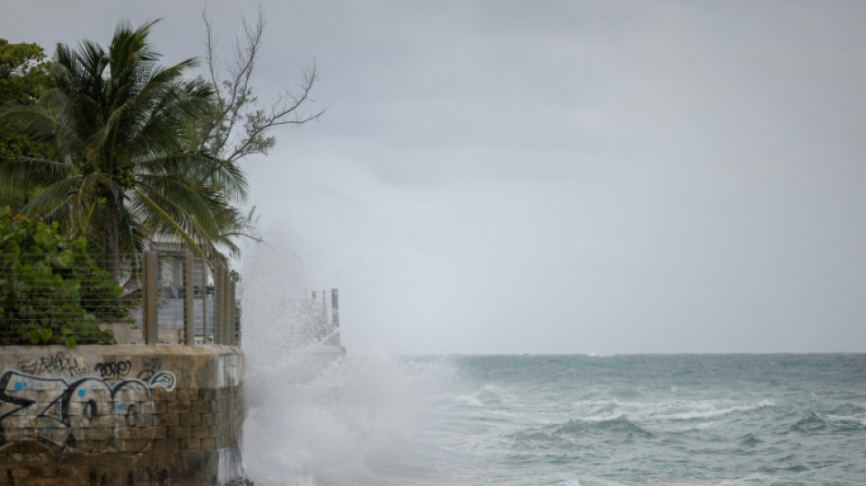 Hurricane Erin intensifies offshore, lashes Caribbean with rain