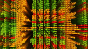 Stocks diverge, dollar slips before tech earnings, Fed decision