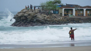 Tourists, fishermen hunker as Hurricane Erick pounds Mexican coast