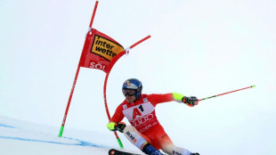 Champion Odermatt opens season with win at wintry Soelden
