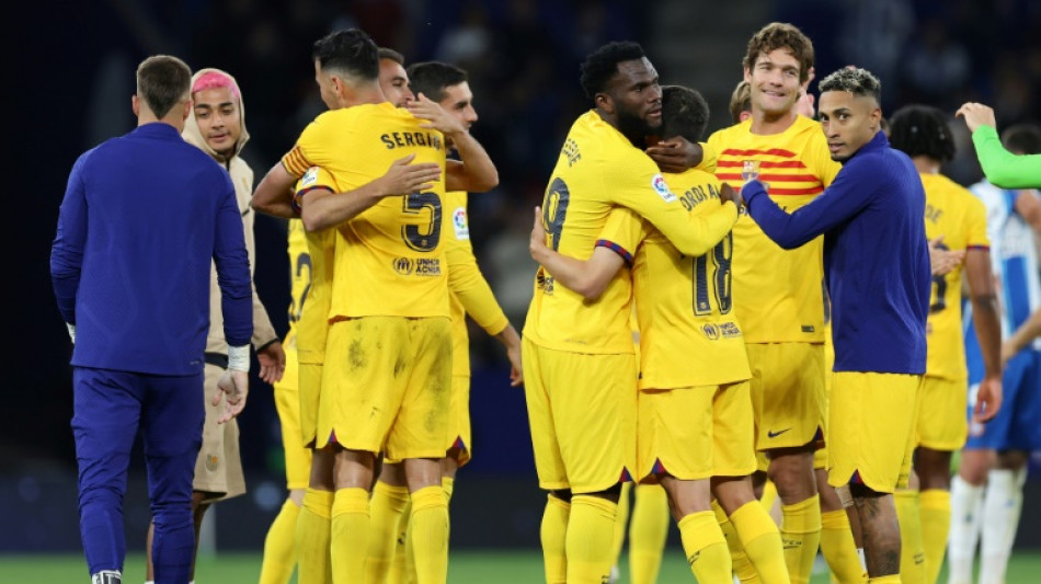 Barcelona earn La Liga title with Espanyol rout