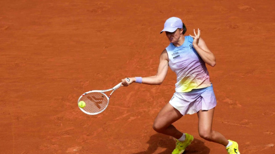 Swiatek says not unbeatable at French Open after winning start