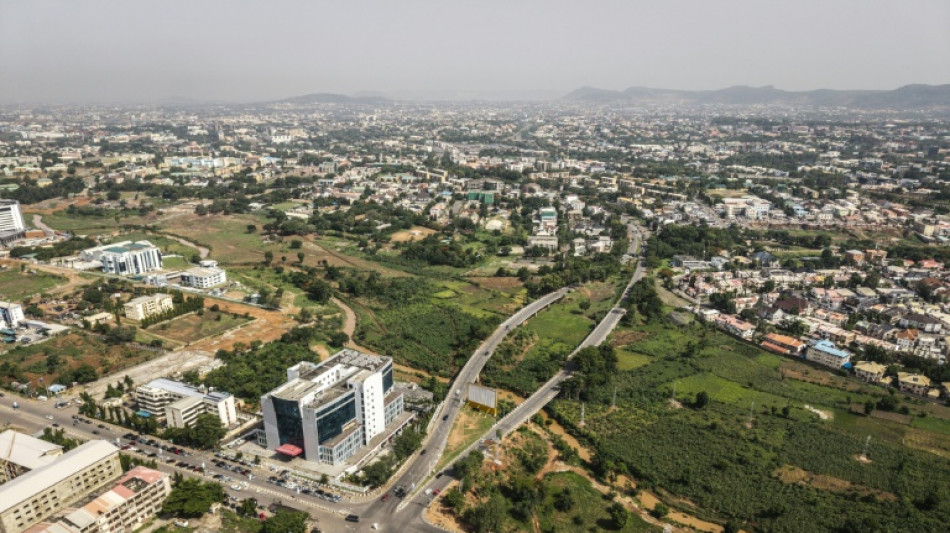 Nigerian farms battle traffic, developers in downtown Abuja