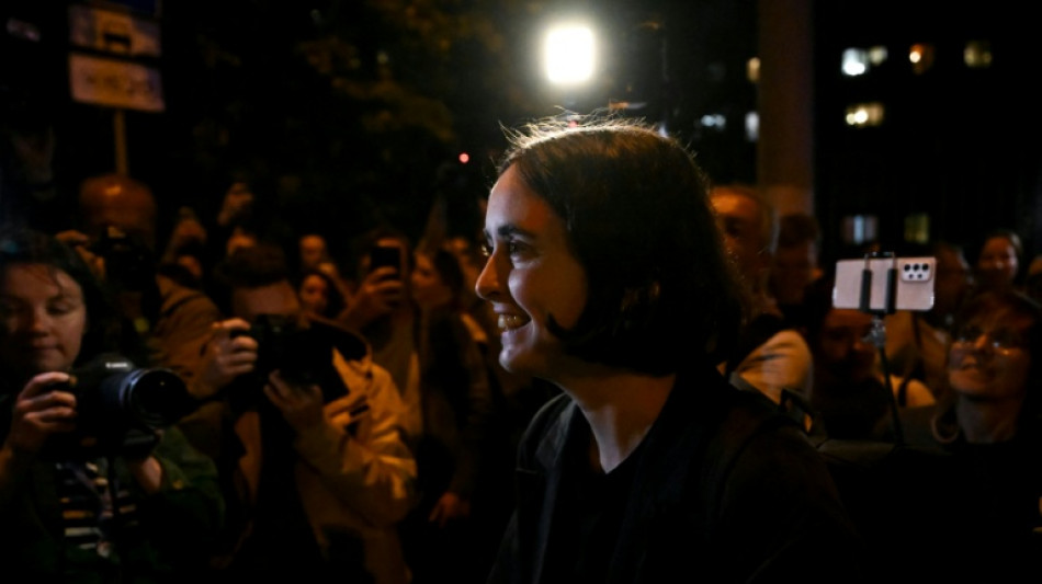 Russia slaps curfew on charity director over army criticism