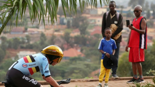 Evenepoel crushes Pogacar to win 3rd straight time-trial cycling world title
