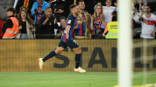 Alba pulls Barca closer to title with late Osasuna strike