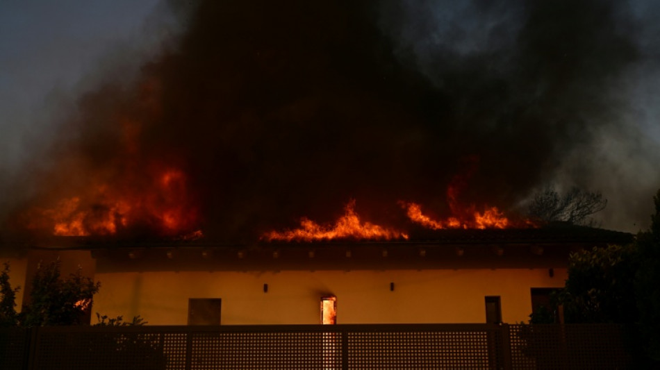 Three die in Greece as gales stoke fires, disrupt ferries