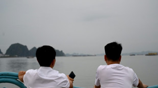 Tearful relatives await news from Vietnam wreck rescue