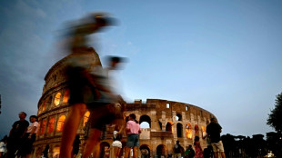 Fleeing the heat, tourists explore Rome at night, underground