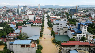 Record flooding hits Vietnam city, eight killed in north