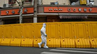 Une ville, deux ambiances: la vie &agrave; Shanghai confin&eacute;e par moiti&eacute;s