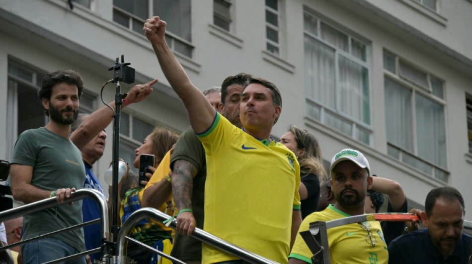 Bolsonaro son rallies the right as thousands protest Brazil government
