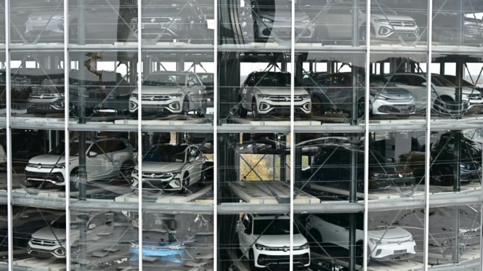 Volkswagen says tariffs will dampen business as profit plunges