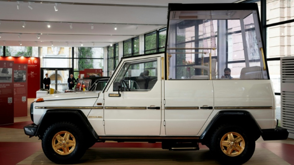 A throne on wheels, popemobiles star in new Vatican show